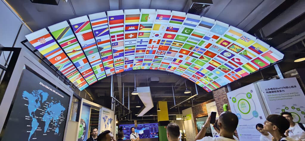 Ceiling display featuring flags of various countries at ZKTeco's Experience Centre, representing global presence and partnerships.