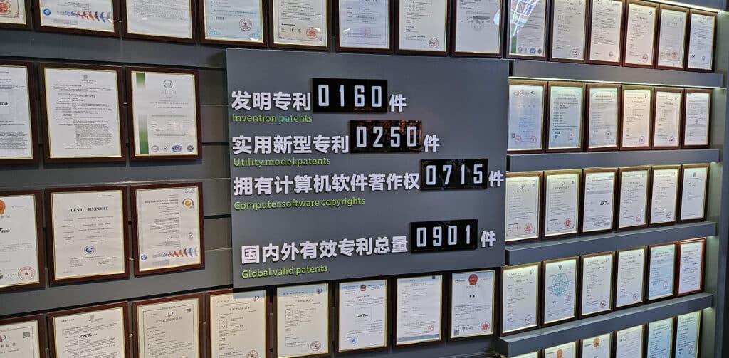 Wall showcasing ZKTeco’s patent achievements, with counters for invention patents, utility model patents, software copyrights, and total global patents.
