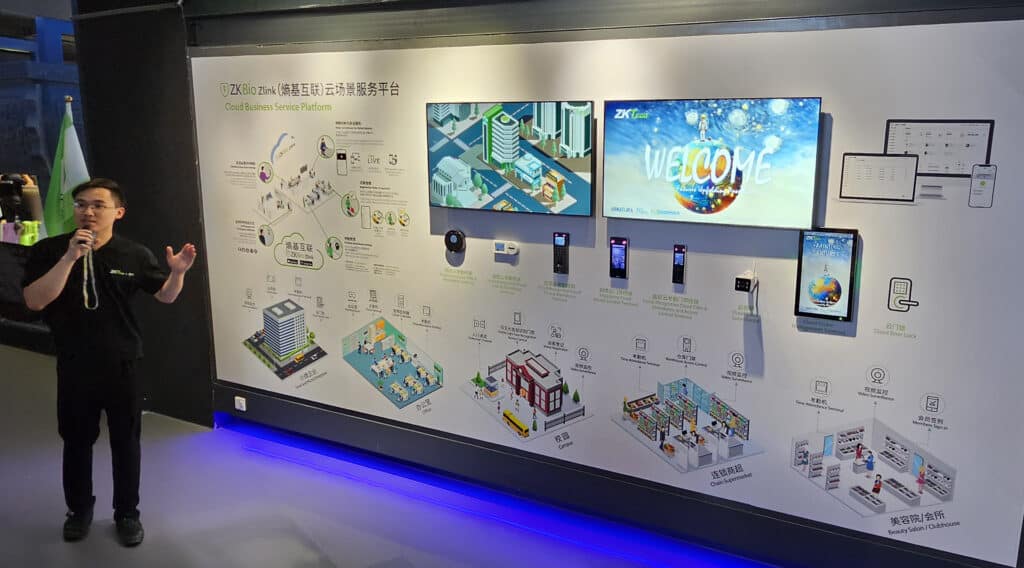 Presentation of ZKBio Zlink Cloud Business Service Platform, showcasing ZKTeco’s integrated smart city solutions for efficient access control and management across various building types.