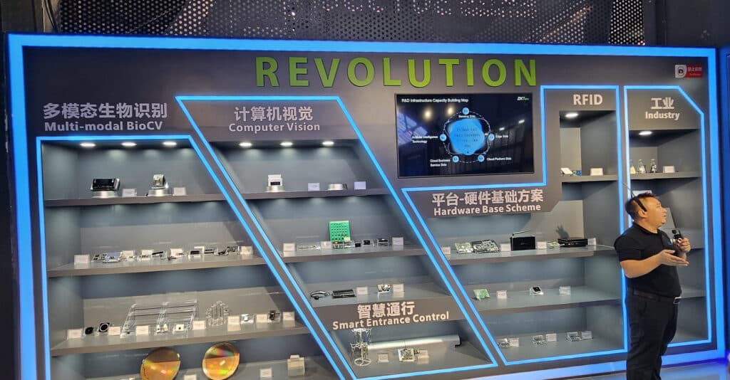 Exhibit titled 'Revolution' showcasing ZKTeco’s advancements in Multi-modal BioCV, Computer Vision, RFID, and Smart Entrance Control, representing cutting-edge technologies in security.