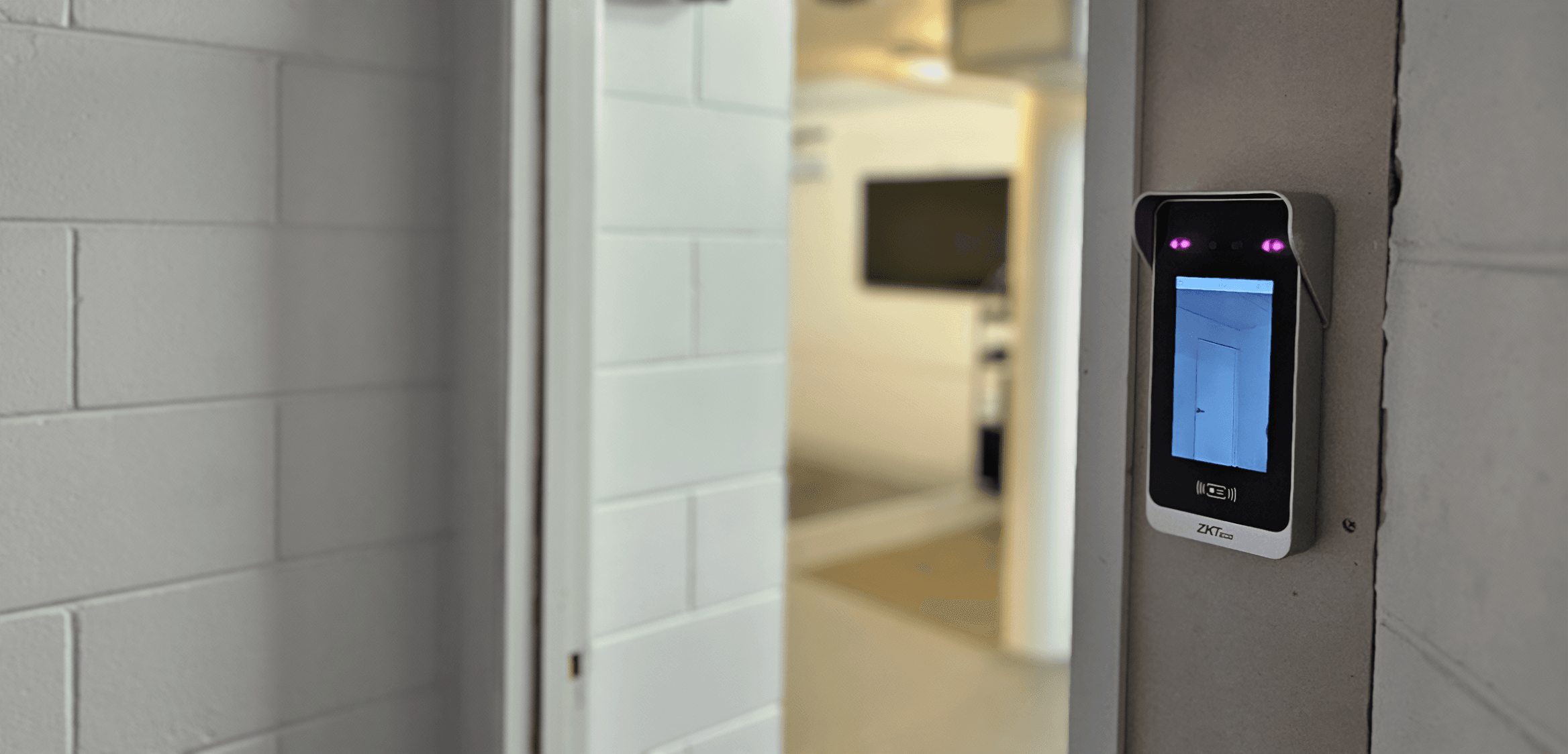 ZKTeco SpeedFace M4 facial and palm recognition access control device installed on wall at The Recovery Lounge AUT Millennium Auckland