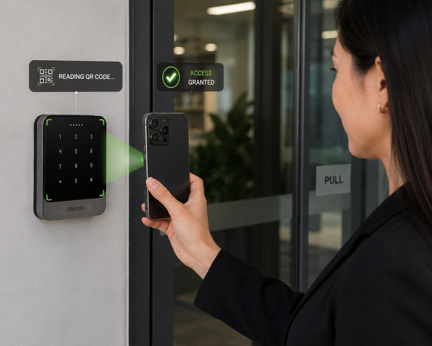 Corporate employee using a mobile QR code credential to unlock an office door with an Armatura access control reader.