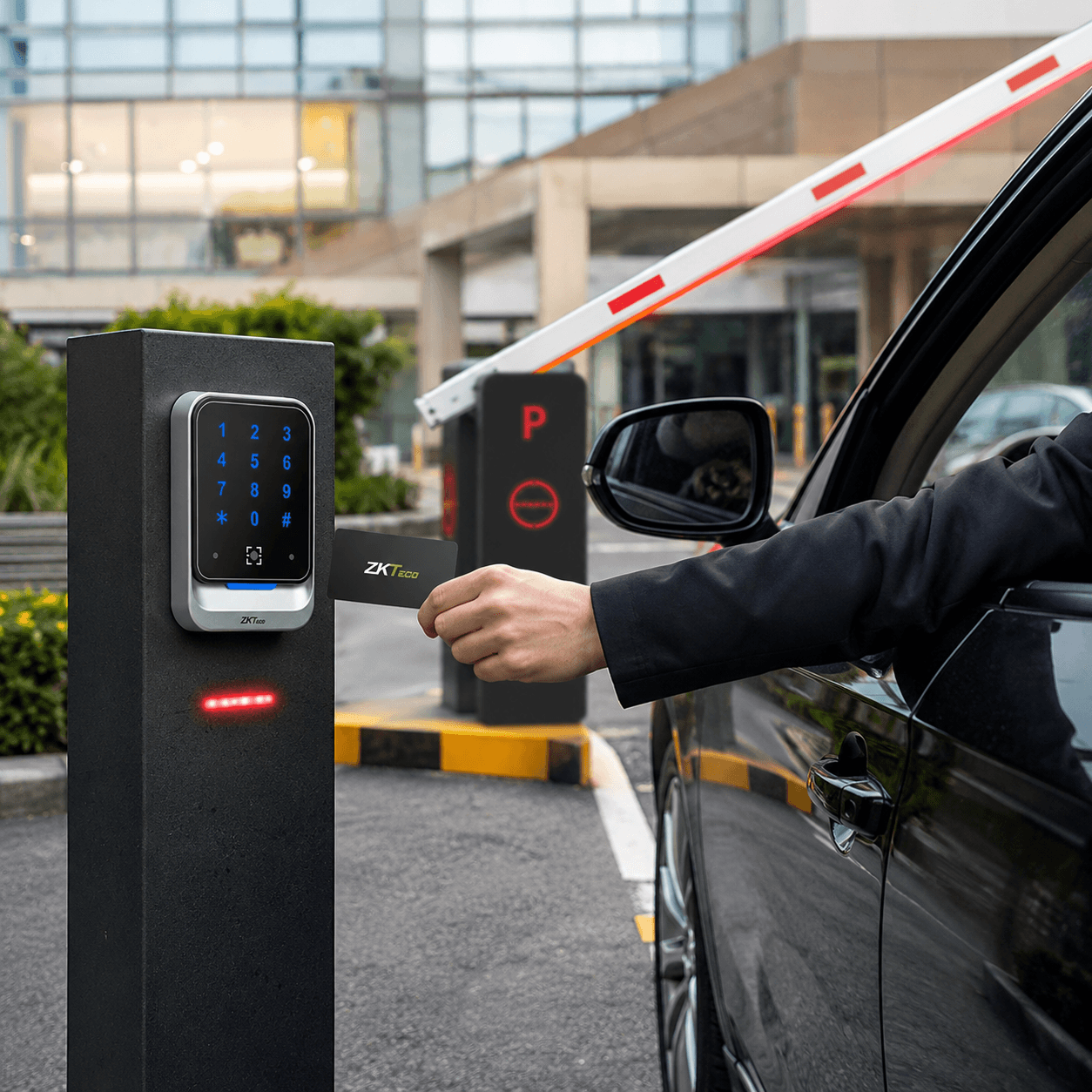 Person scanning a ZKTeco access card at a QR600 reader on a pedestal to open a vehicle barrier.
