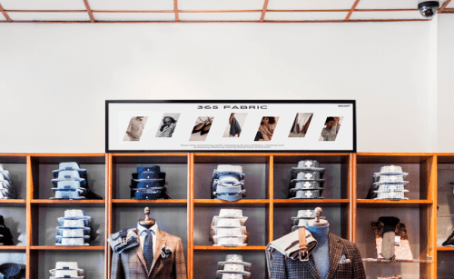 ZKDigimax LCD Shelf Display in a clothing-store retail shelf installation