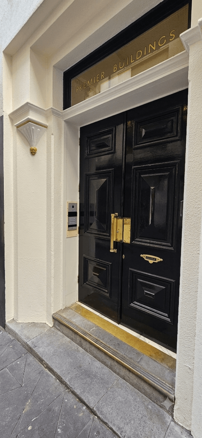 ZKTeco VEX-B21L video intercom installed at the main entrance of CP Group office in Auckland CBD with surrounding entryway visible